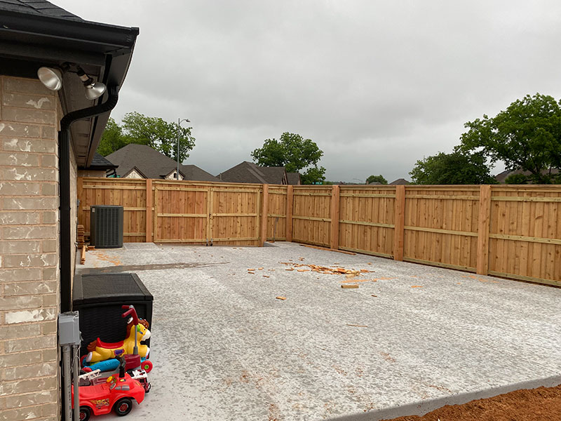 wood fence installed in the backyard of a house granbury tx